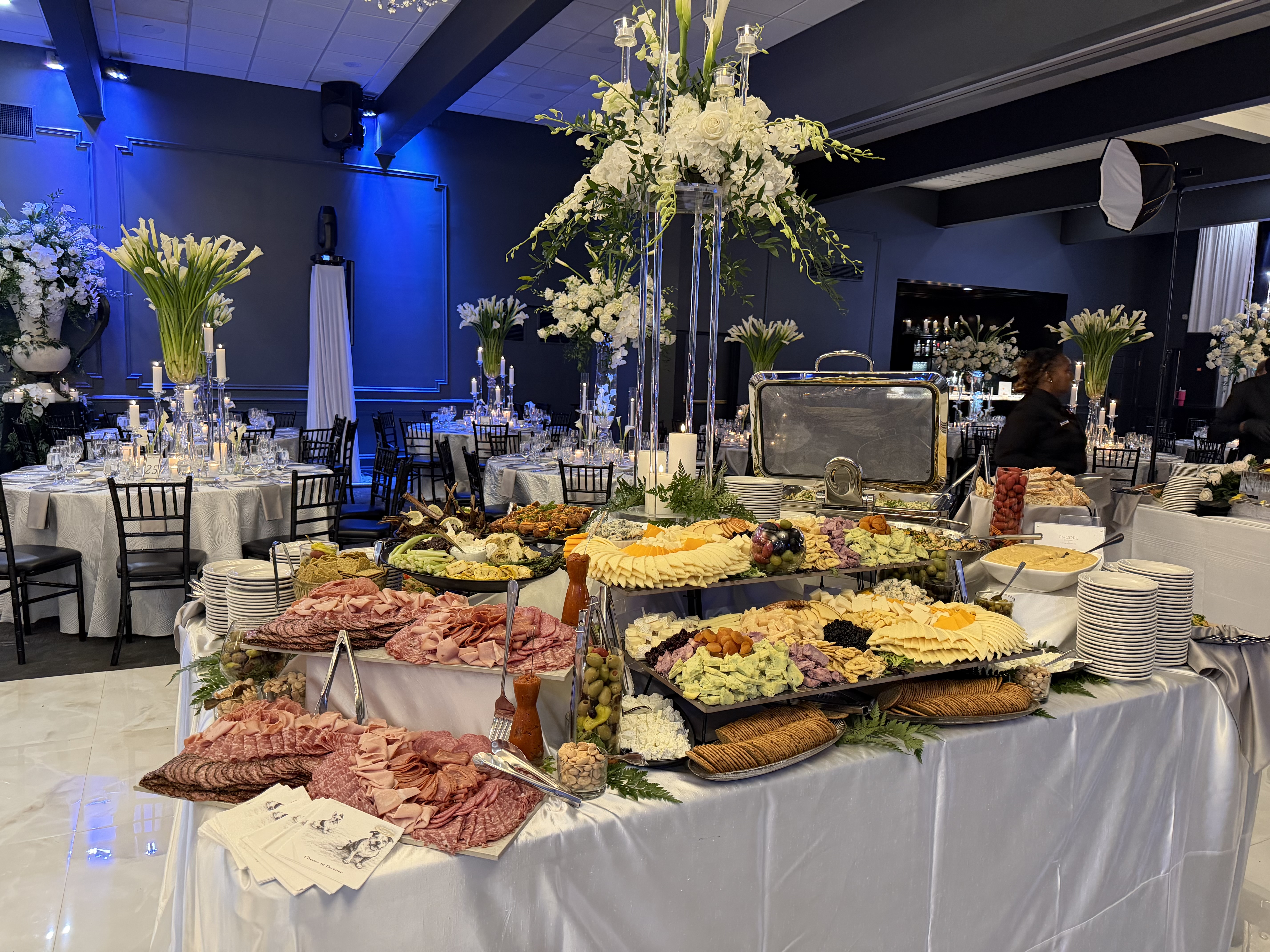 A tiered charcuterie and cheese station at a Crush for the Capuchins event
